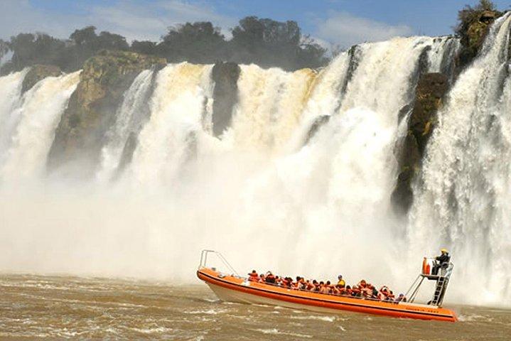 Motorboat under the waterfalls, 4x4 truck in the jungle with Argentine Falls