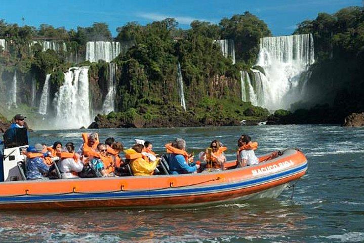 Motorboat under the waterfalls, 4x4 truck in the jungle with Argentine Falls