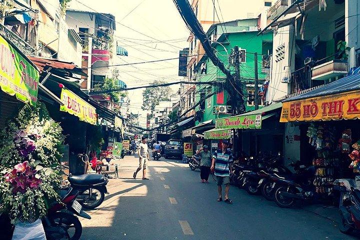 Morning Saigon Unseen+Street Food Tour with Ao Dai Riders Option
