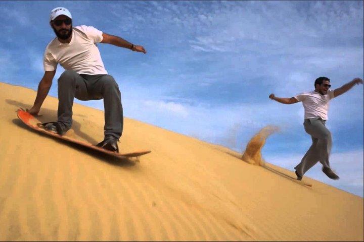 Private Desert Sandboarding Camel riding tour