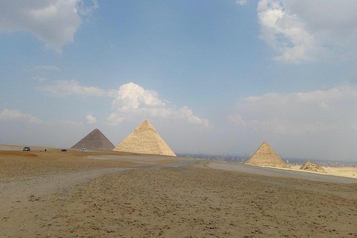 Giza pyramids sunset camel ride with local dinner