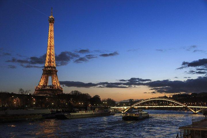 Paris By Night with Seine River Cruise and Roundtrip Luxury Transportation