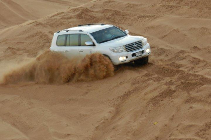 Morning Red Dunes Desert Safari With Camel Ride And Sand Boarding