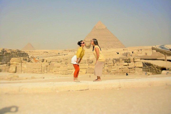 Camel Ride around the Pyramids During Sunrise Or Sunset
