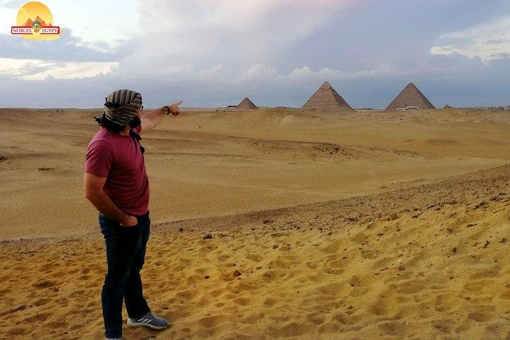 Sunset at Giza pyramids by camel