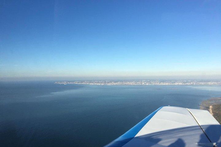 Fly above Normandy's hallowed coastline in a private plane