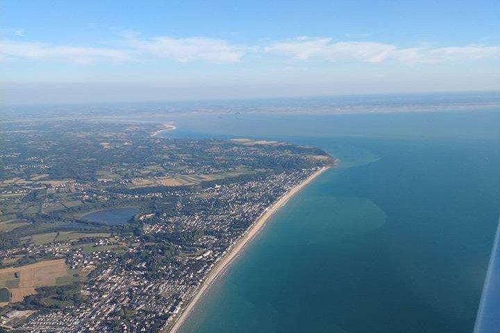 Fly above Normandy's hallowed coastline in a private plane