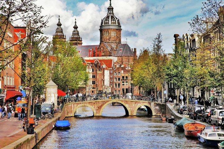 Airport Transfer: Schiphol Airport AMS to Amsterdam by Luxury Van