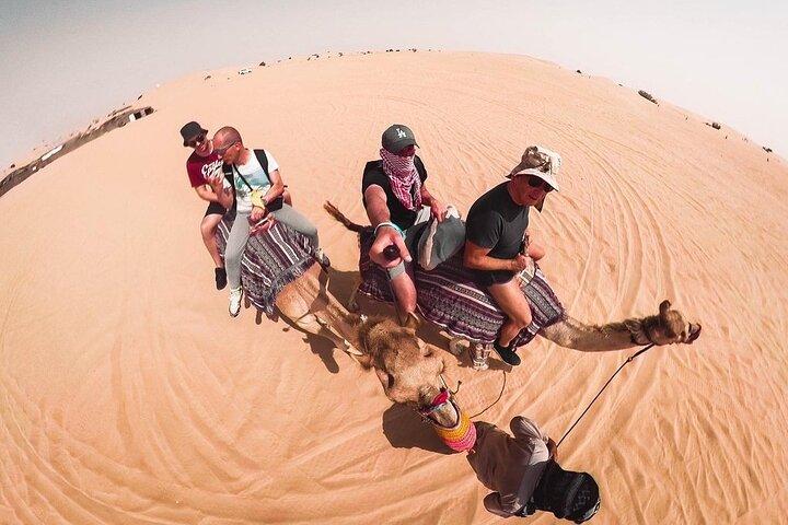 Morning Dune Bashing, Including Camel Riding and Sand Boarding from Dubai
