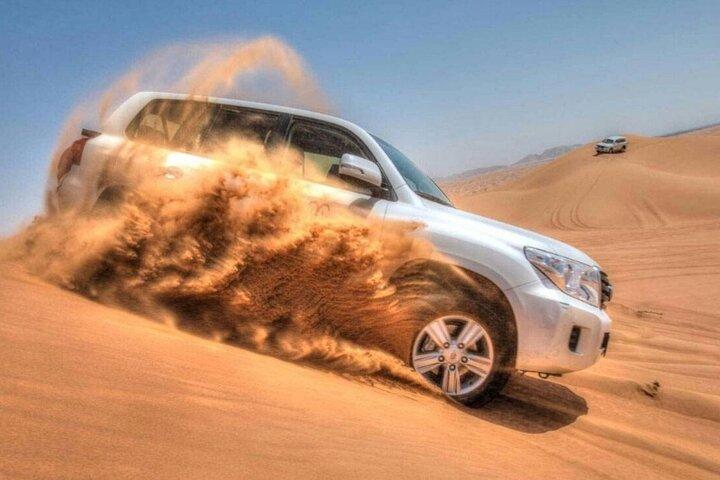 Dubai Desert Safari with Camel Riding, Sand Boarding,BBQ Dinner and 3 Live Shows