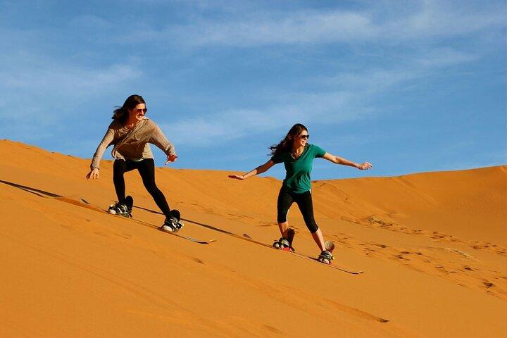 Sunset Camel Ride with Sandboarding and Lavish BBQ Dinner Buffet