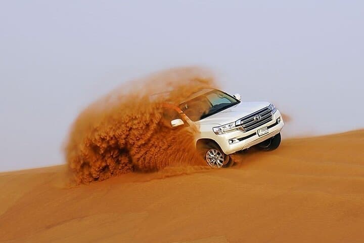 Private Evening Desert Safari Premium Camp: BBQ Camel & Sandboard