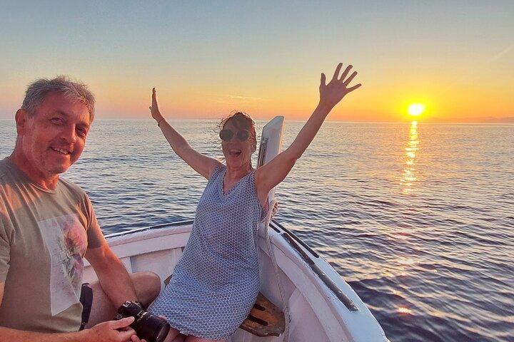 Cinque Terre sunset boat tour with a traditional ligurian gozzo