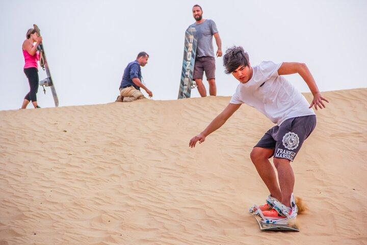 One hour Quad Bike at Red Sand Desert Safari with Camel Ride and BBQ Dinner