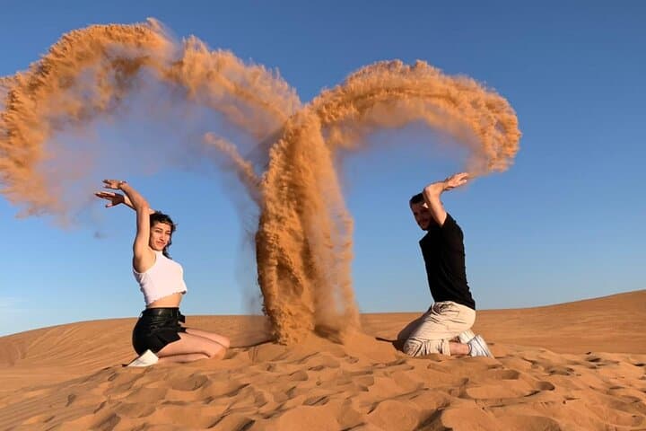 Desert Safari with Camel Ride, BBQ Dinner, Sand Board & Live Show
