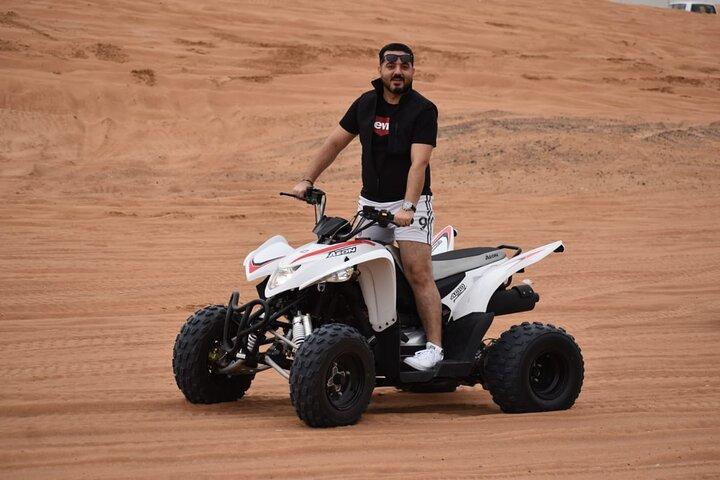 Dubai Evening Desert Safari with Quad Bike, Camel Ride and BBQ