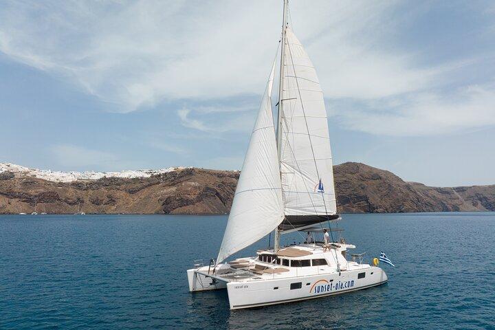 Santorini Luxury Sailing Catamaran Cruise with BBQ, Drinks and Transfer