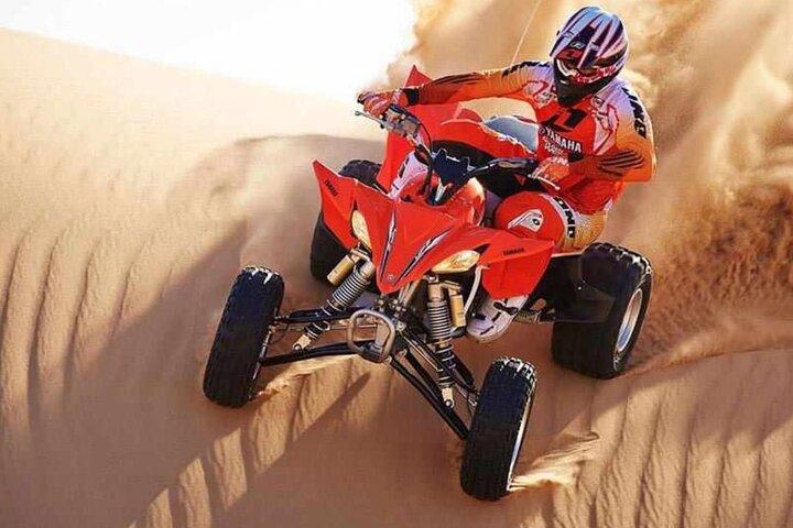 Desert Safari Dubai 25 minutes Quad Bike Free Camel Ride BBQ Dinner