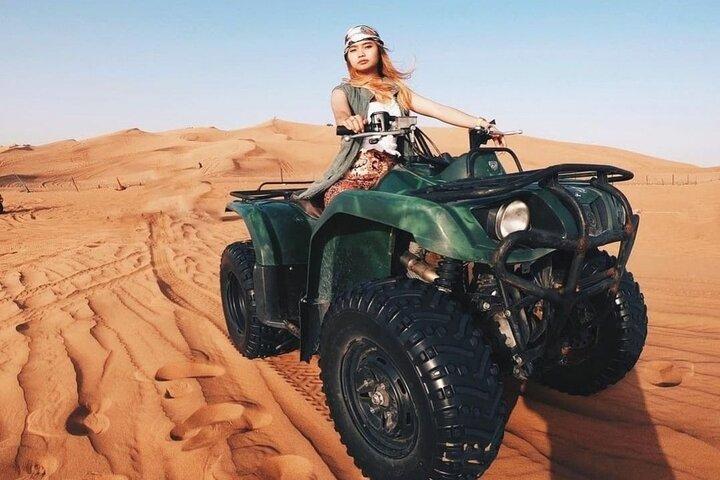 Desert Safari Dubai 25 minutes Quad Bike Free Camel Ride BBQ Dinner