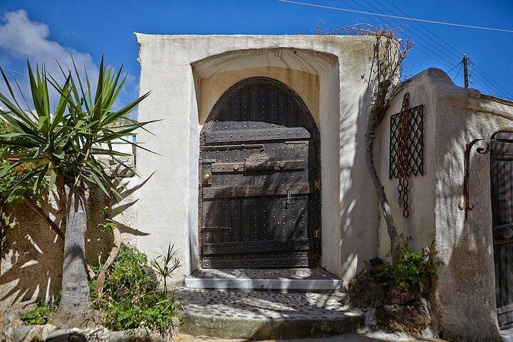 Santorini wine tasting and Traditional Cave Settlement Tour