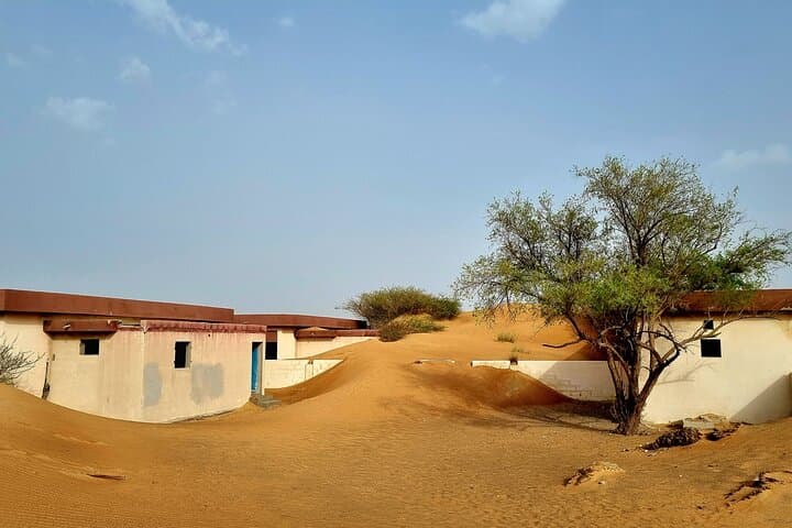 The Ghost Village Safari Tour with Dune Bashing and Sandboarding