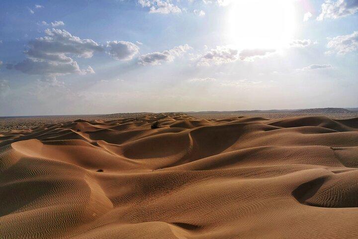 Rub Al Khali Desert Safari: Sunset, Sandboarding & Black Camels