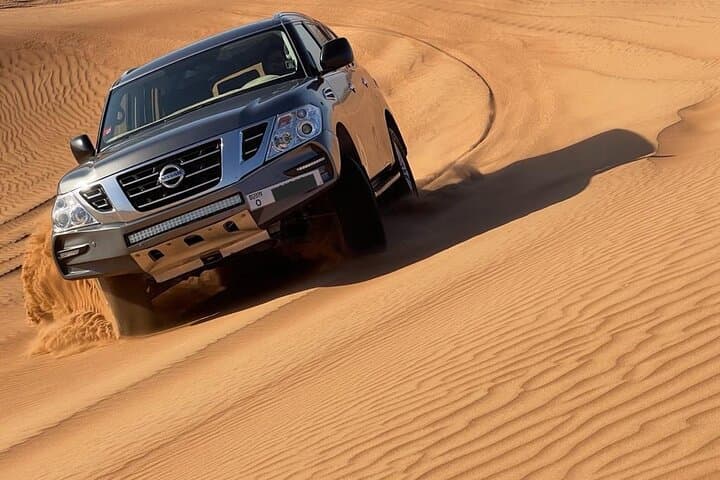 Private Afternoon Desert Safari with Quad Bike, Camel Ride and Sandboarding