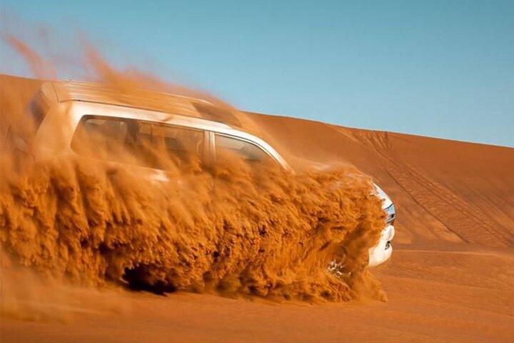 Red Dune Bashing with Camel Ride Sandboard Sunset Pictures & BBQ Dinner