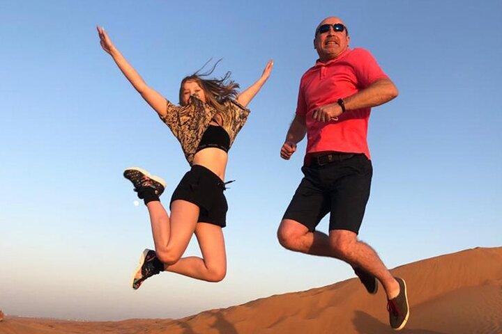 Red Dune Bashing with Camel Ride Sandboard Sunset Pictures & BBQ Dinner