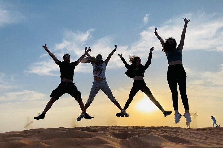 Morning Desert Safari with Dune Bashing, Camel Ride, Sand Board & Quad Biking