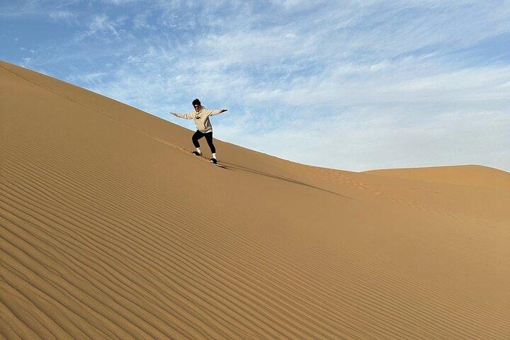Abu Dhabi Morning Desert Safari with Camel Ride & Sandboarding
