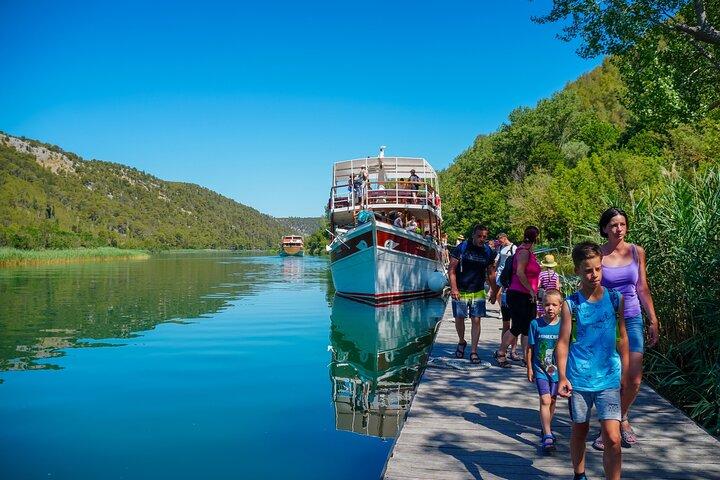 From Split: Krka Waterfalls Trip with Boat Cruise and Swimming