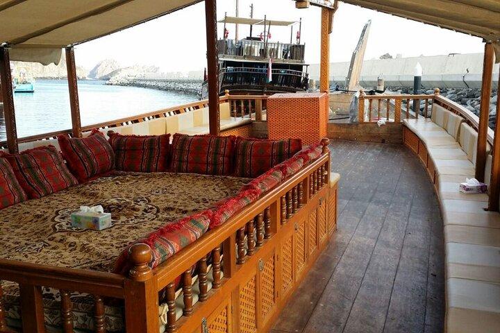 Omani Traditional Dhow Cruise: Sunset and Muscat Coastal View