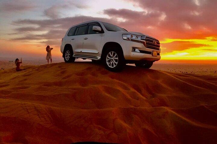 Dubai Dune Bashing with Camel Ride, Sandboarding & BBQ Dinner