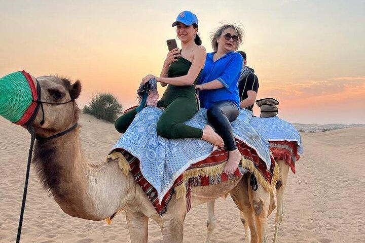 Dubai Dune Bashing with Camel Ride, Sandboarding & BBQ Dinner