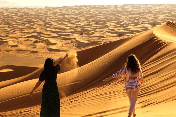 Private Dubai Sunrise with Red Dune Bashing camel ride boarding