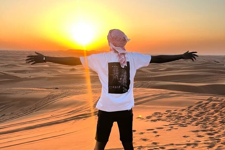 Dubai Evening Desert Safari Dune Bashing Camel Ride & BBQ Dinner