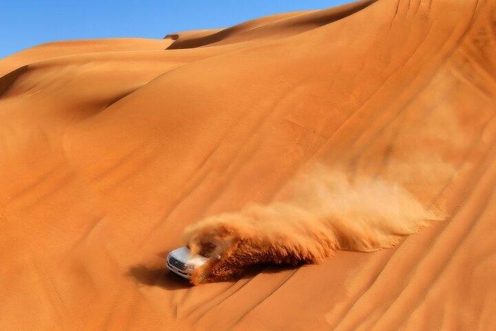 Private Dubai Sunrise with Red Dune Bashing camel ride boarding