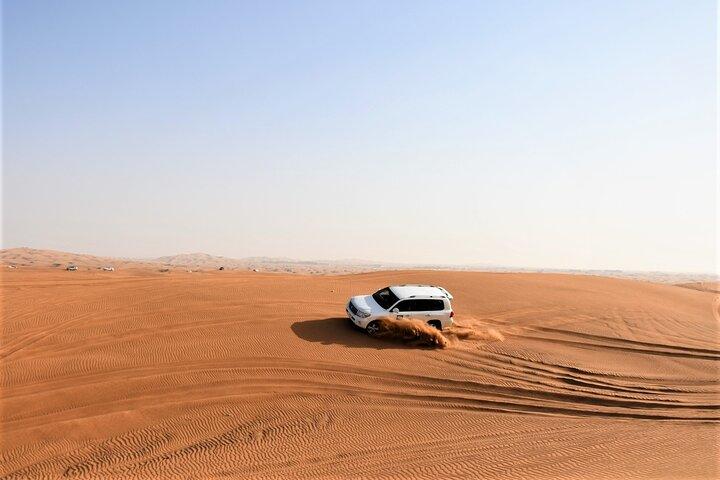 Premium Red Dunes Bashing with Quad Bike, Camel, Falcon &VIP Camp