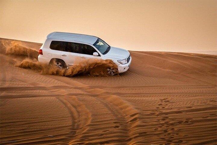 Sunset Desert Safari Dubai with Camel Ride and Sandboarding