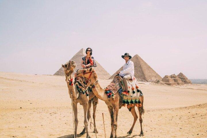 Guide on site Day Tour to Giza Pyramids By Camel from Cairo