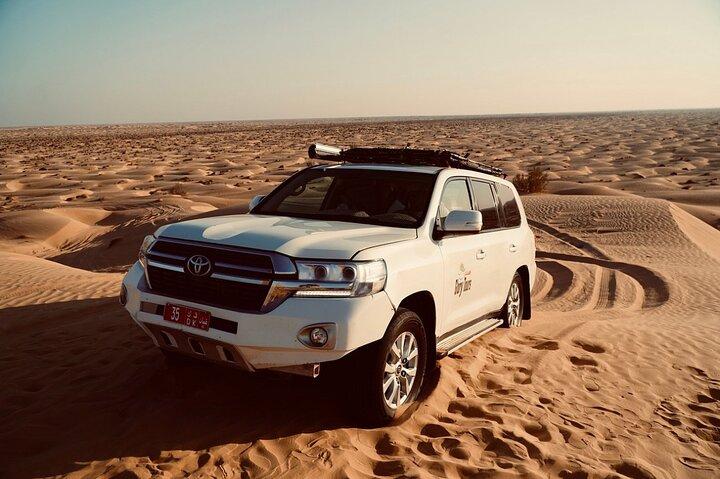 Rub Al Khali Desert Safari: Sunset, Sandboarding & Black Camels
