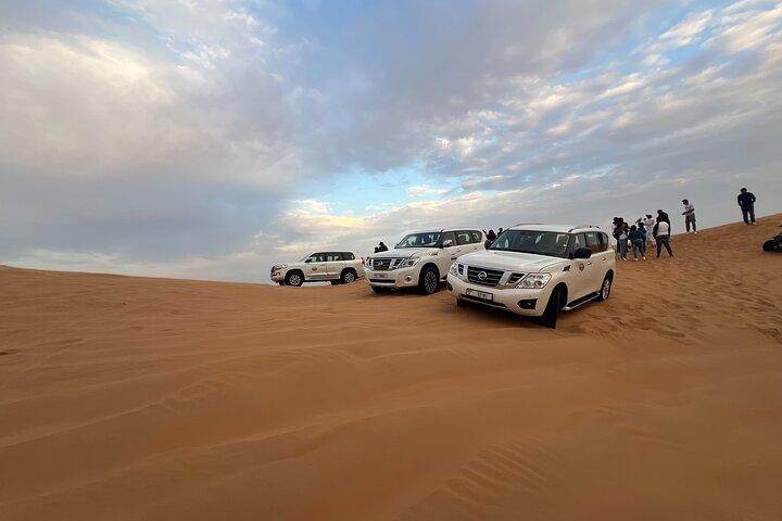 Morning Red Dune Desert Safari Camel Ride and Sandboarding