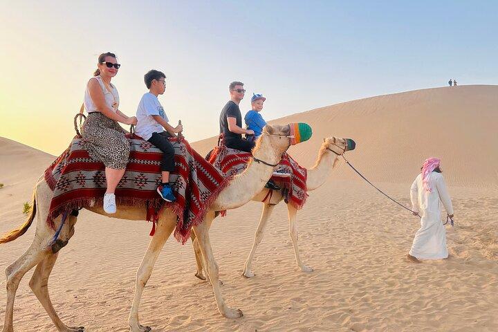 Abu Dhabi Desert Safari with Sandboarding, Camel Ride & Dinner