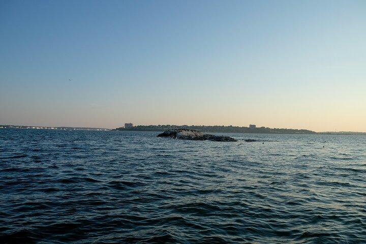 Small Group Sunset Lighthouse Boat Cruise With Local Drinks