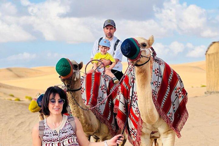 Abu Dhabi: 7-Hours Desert Safari with BBQ, Camel Ride & Sandboarding