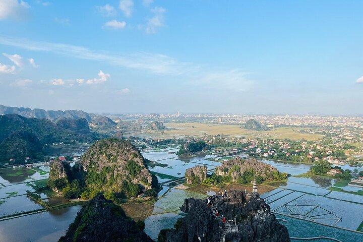 Ninh Binh Highlights: Biking, Swimming, Sunset Party from Hanoi