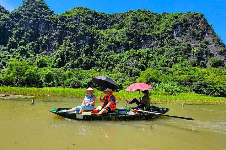 Ninh Binh Highlights: Biking, Swimming, Sunset Party from Hanoi