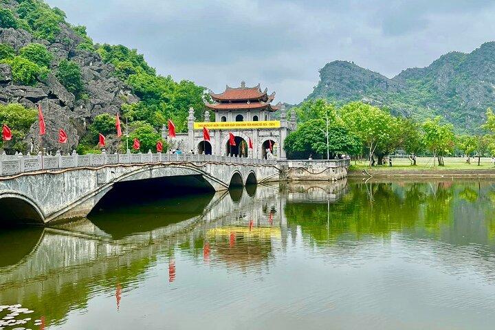 Ninh Binh Highlights: Biking, Swimming, Sunset Party from Hanoi