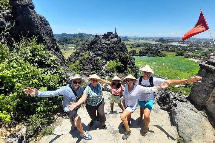 Ninh Binh Highlights: Biking, Swimming, Sunset Party from Hanoi